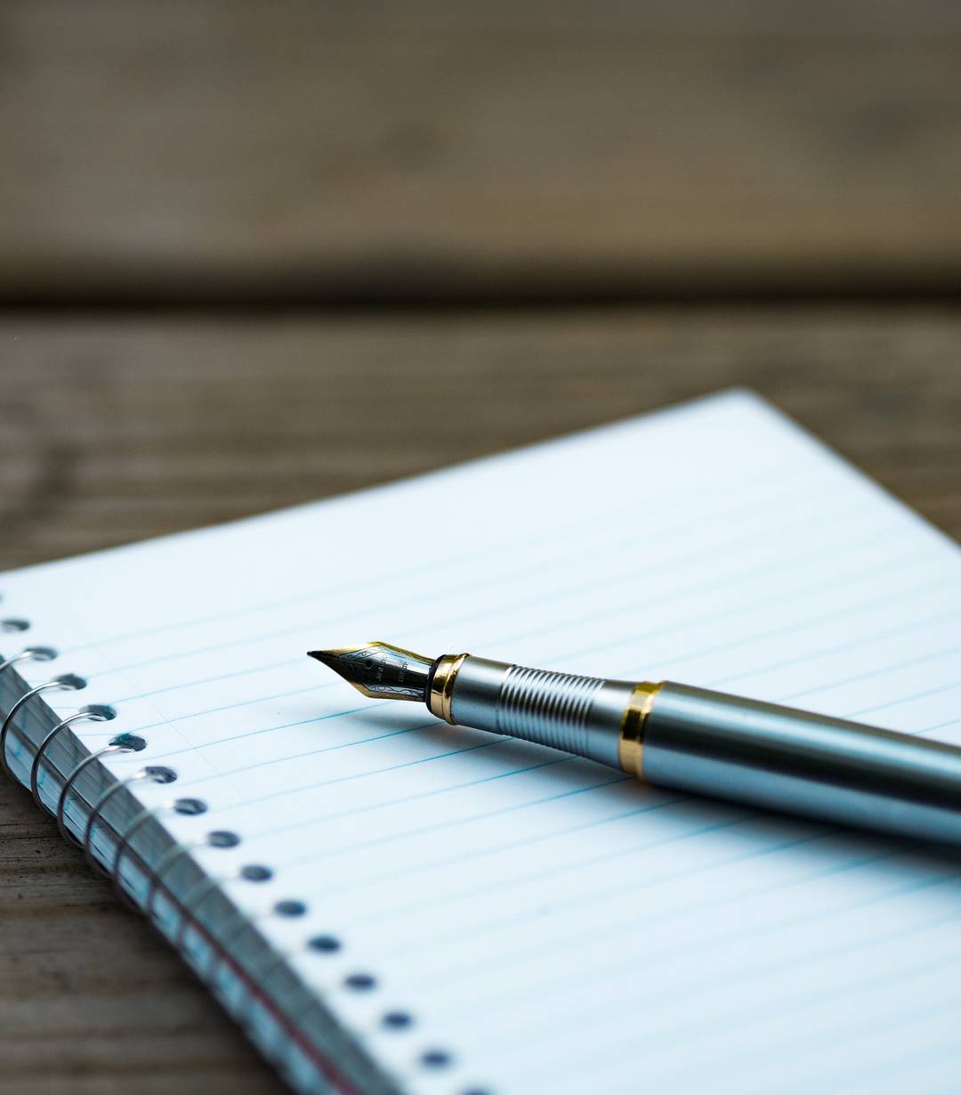 Fountain pen resting on a notebook