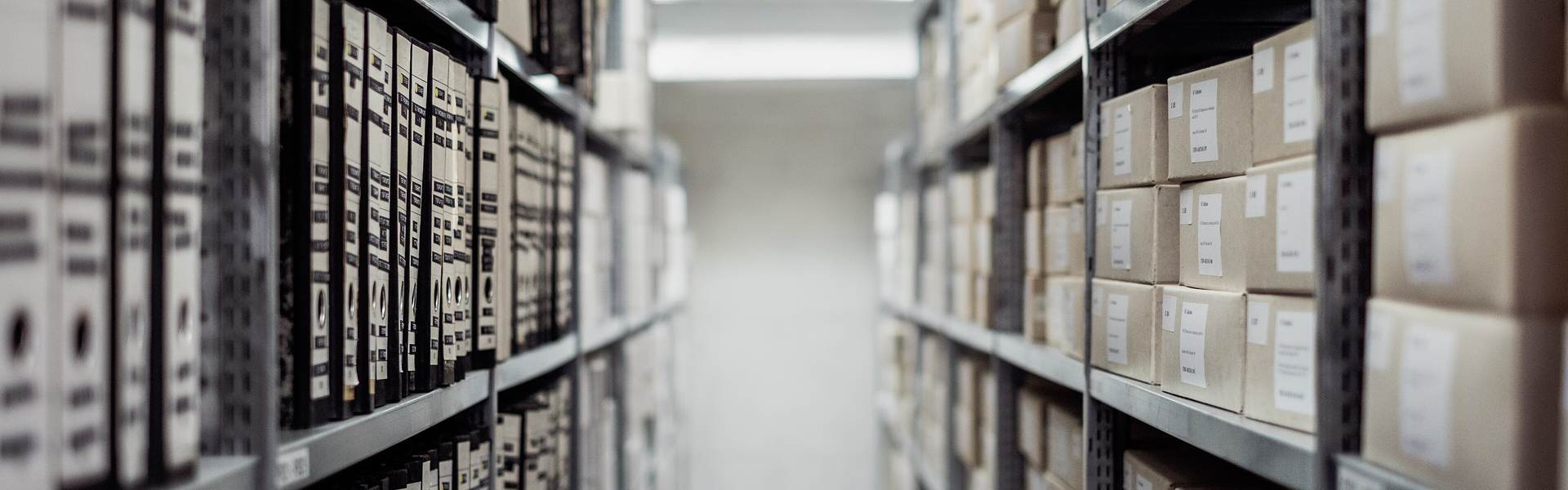 Archive shelves filled with boxes and binders