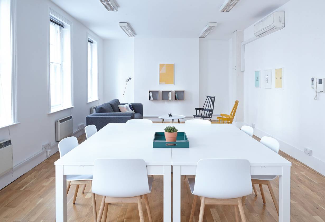 Bright office with white meeting tables