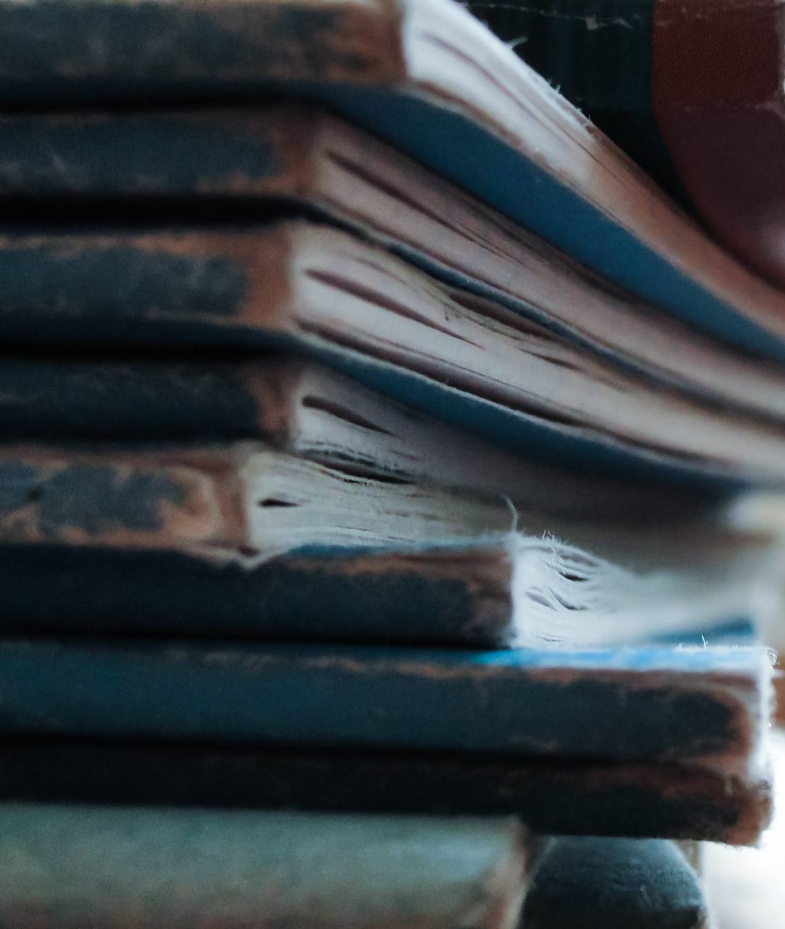 Stack of bound ledgers and folders